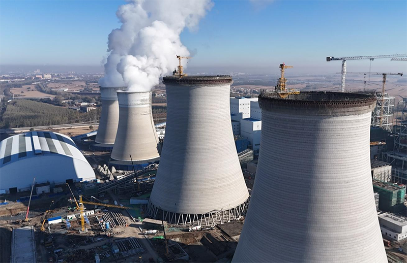 筑顶冰城暖源！国能哈热二期项目3号排烟冷却塔顺利封顶
