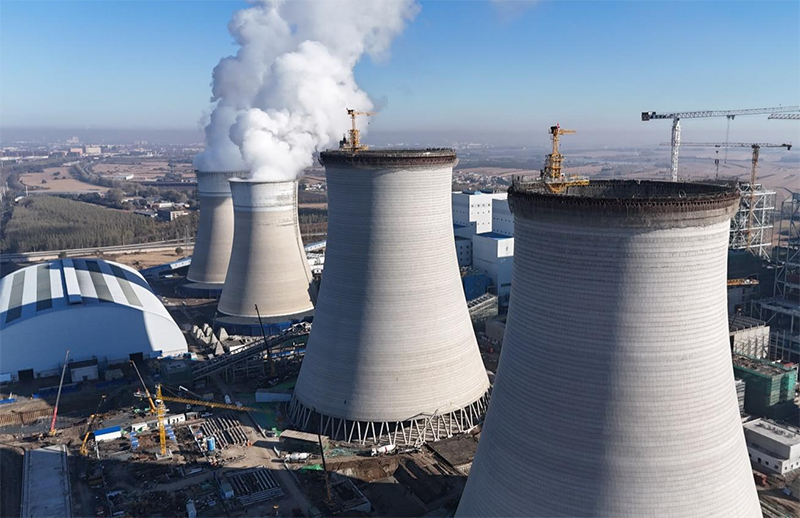 筑顶冰城暖源！国能哈热二期项目3号排烟冷却塔顺利封顶